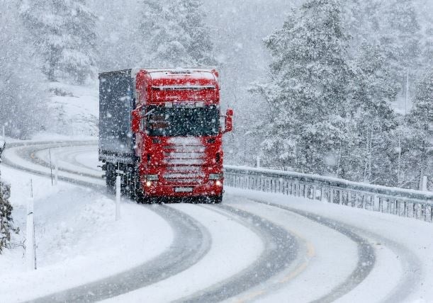 Truck driving on winter road